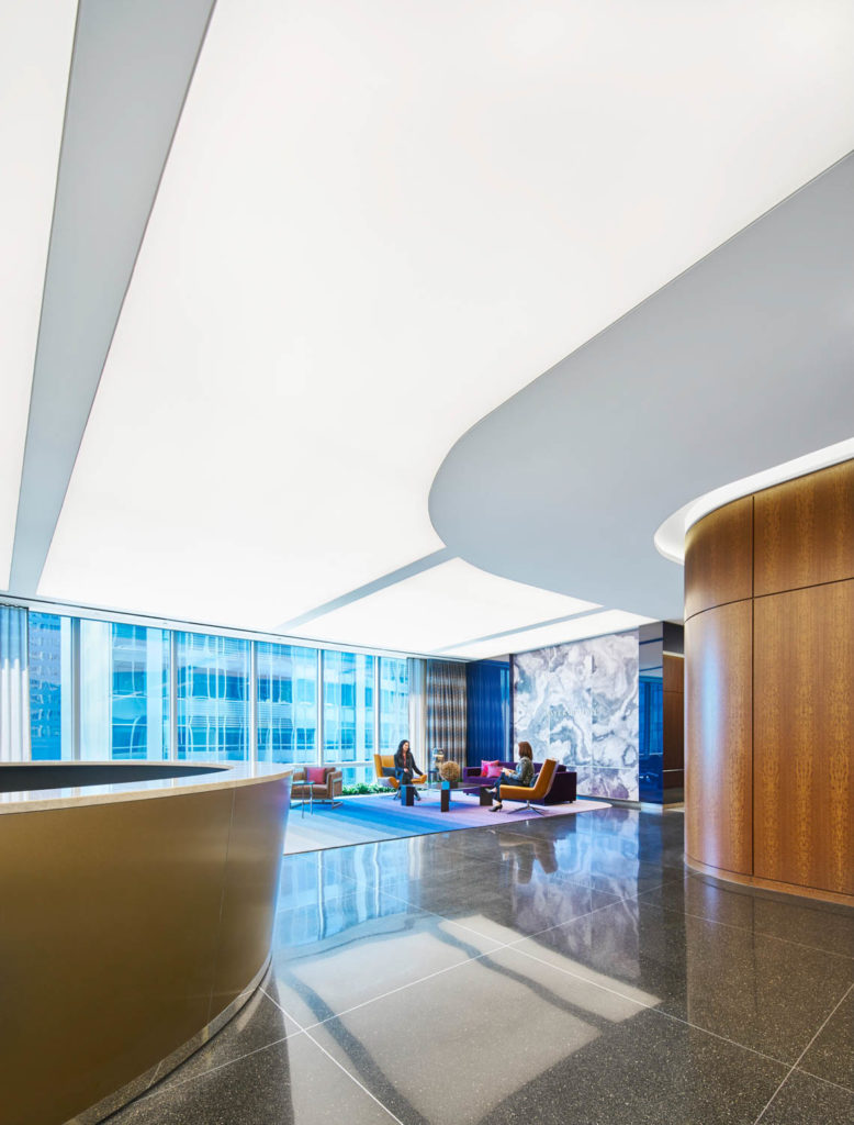 Mayer Brown by Gensler, reception with a sweeping white ceiling and curved wood wall, Chicago