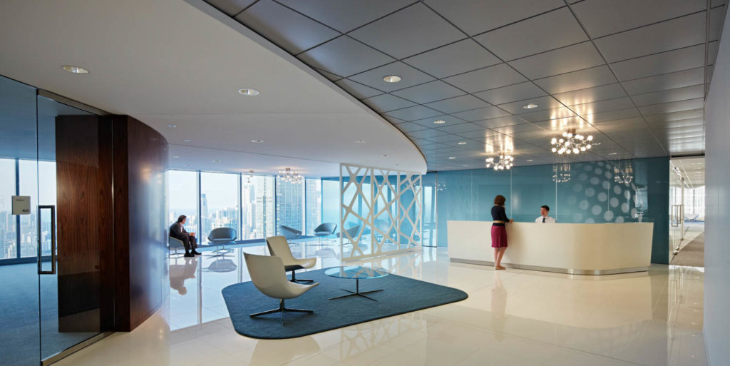 United Healthcare by CannonDesign, reception with a blue patterned screen, curving ceiling and city views, Chicago