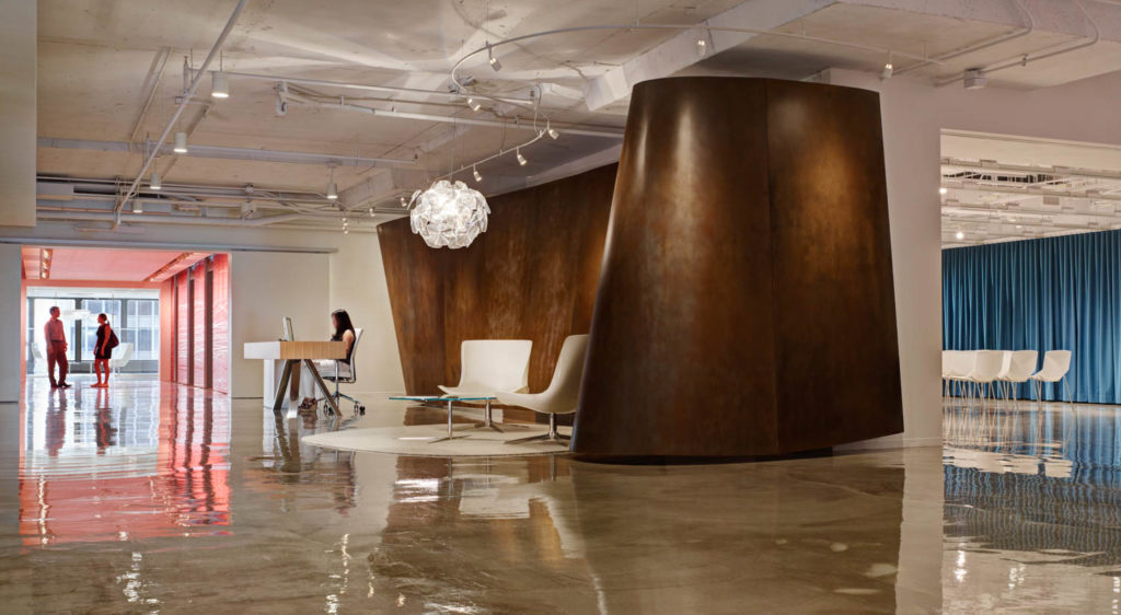 CannonDesign Chicago Office by CannonDesign, reception with a large weathered steel enclosure, Chicago
