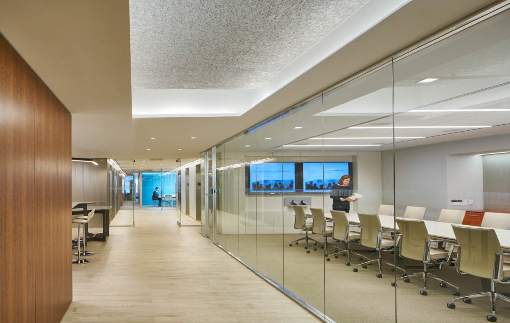 Hogan Lovells by Gensler, glass-walled conference rooms along a corridor, Washington
