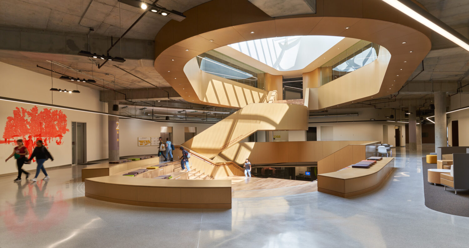 The Heart at the Western Michigan University Student Center, a cedar-lined atrium with the Gathering Stair rising to an oval skylight