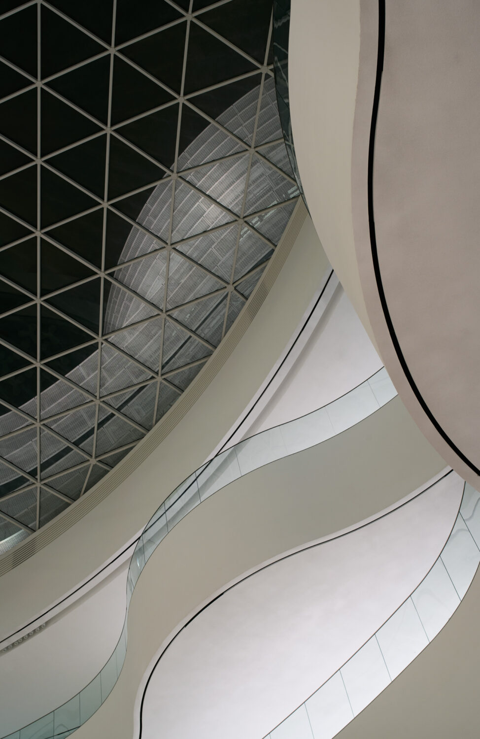 Triangulated skylight above curving white balconies in the CJ Blossom Park atrium