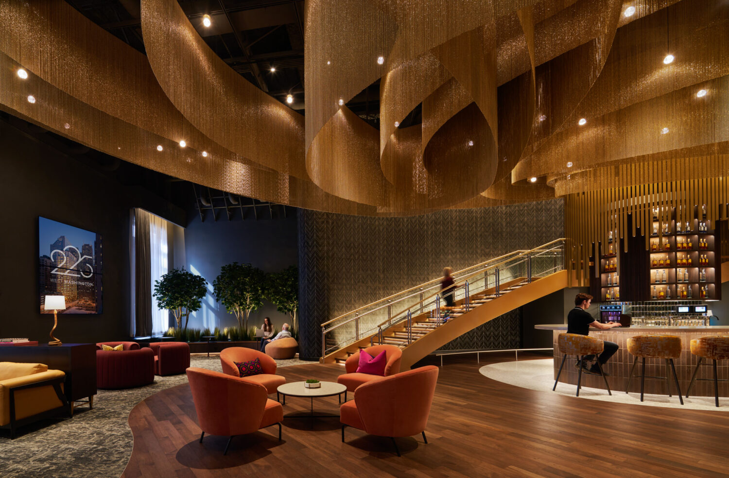 Lounge at 225 West Washington by Wright Heerema, warm wood ceiling and red chairs, Chicago