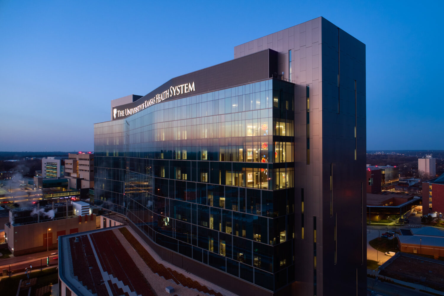 Glass patient tower at dusk above the city, Cambridge Tower A, The University of Kansas Health System by CannonDesign, Kansas City, Kansas