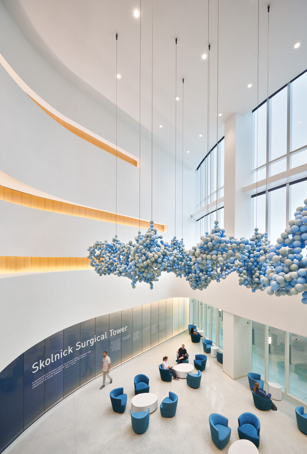 Atrium with a suspended blue sculpture above lobby seating, Skolnick Surgical Tower by CannonDesign, Miami Beach, Florida