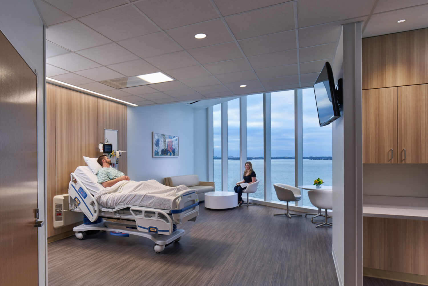 Patient room with floor-to-ceiling windows overlooking the bay, Skolnick Surgical Tower by CannonDesign, Miami Beach, Florida