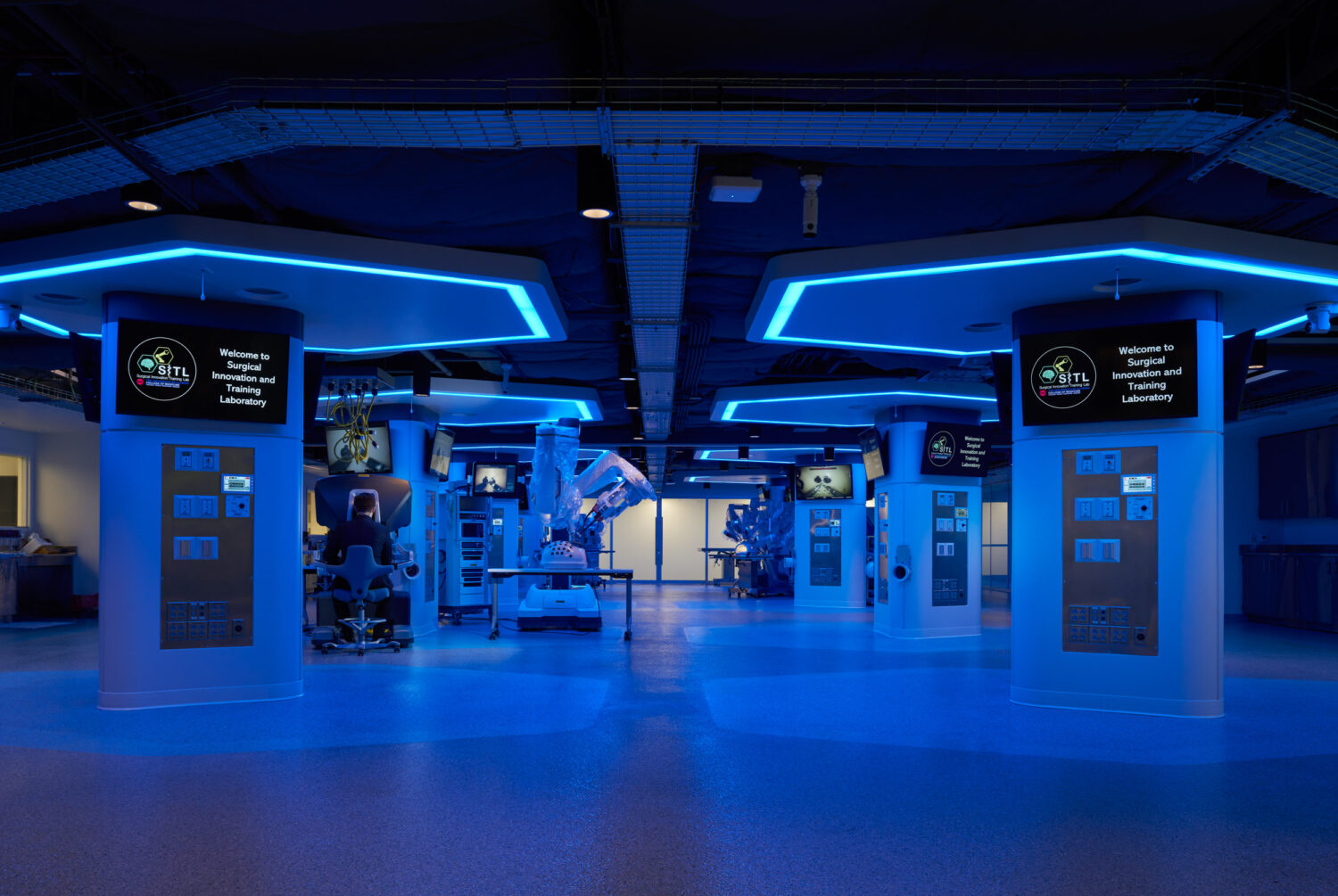 Surgical training lab glowing in blue light, UIC Surgical Innovation and Training Laboratory by CannonDesign, Chicago, Illinois