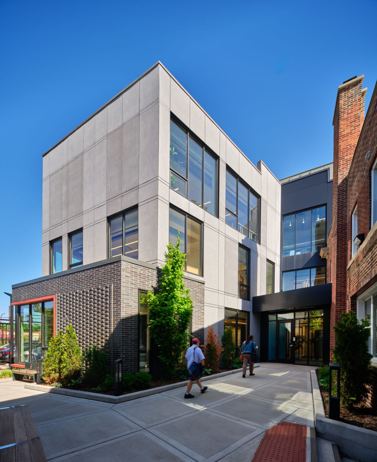 Courtyard walk leading to the glass entrance of Thresholds Center for Mental Wellbeing South
