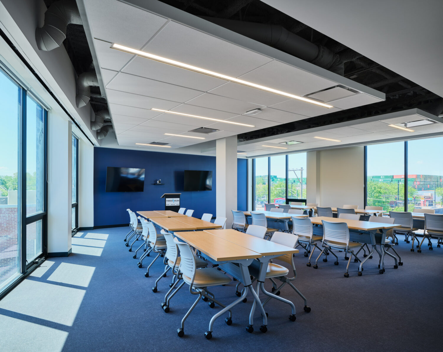 Third floor conference center with rows of tables and city views at Thresholds Center for Mental Wellbeing South