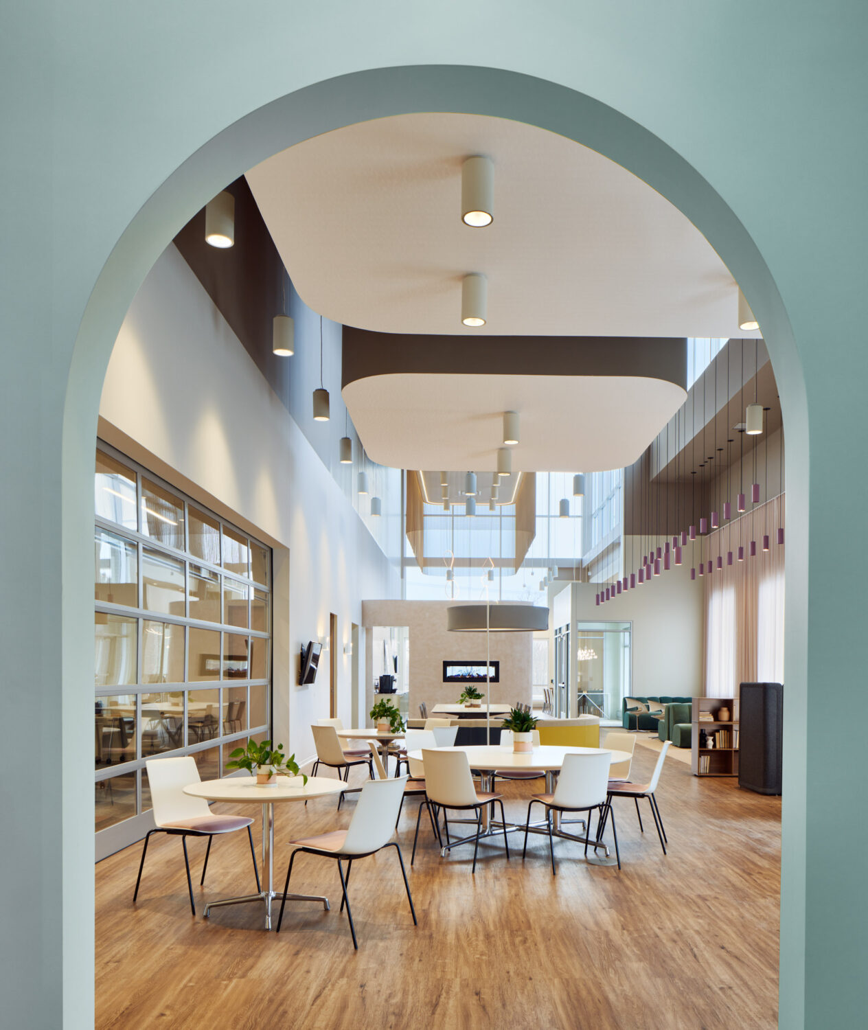 Mint green arch framing the cafe and showroom at Forward Space