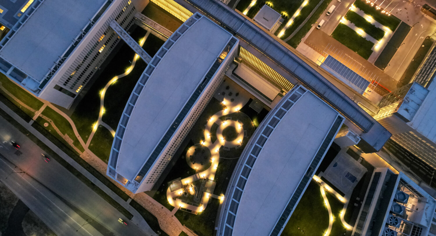 Aerial night view of the campus with lit garden pathways, Rocky Mountain Regional VA Medical Center by SOM, Aurora, Colorado