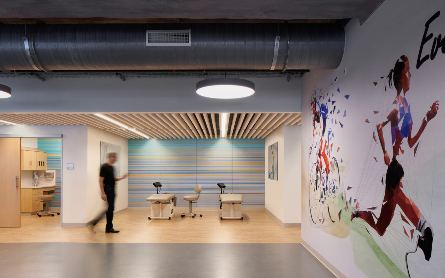 Pediatric therapy space with a mural of a runner, Advocate Illinois Masonic Medical Center by SmithGroup, Chicago, Illinois