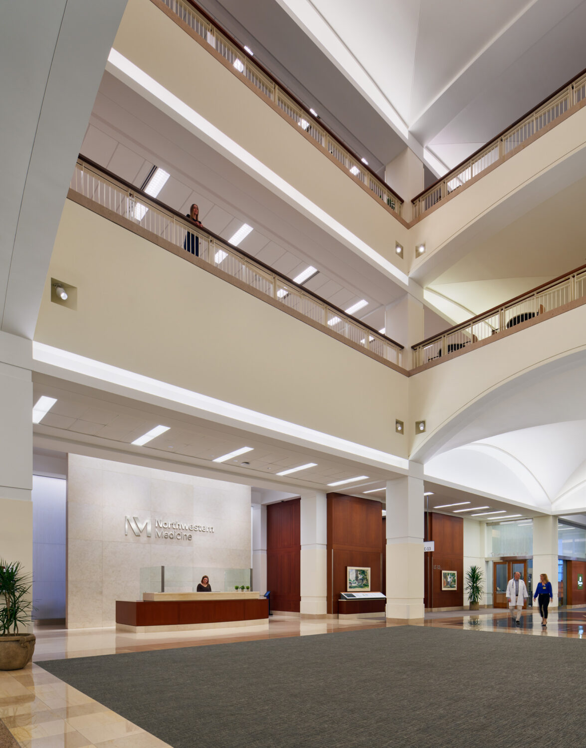 Multistory atrium and reception desk, Northwestern Memorial Hospital by Stantec, Chicago, Illinois